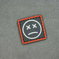 PVC Velcro Patch Sad Face Black, Red and White