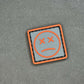 PVC Velcro Patch Sad Face Dark Grey and Orange