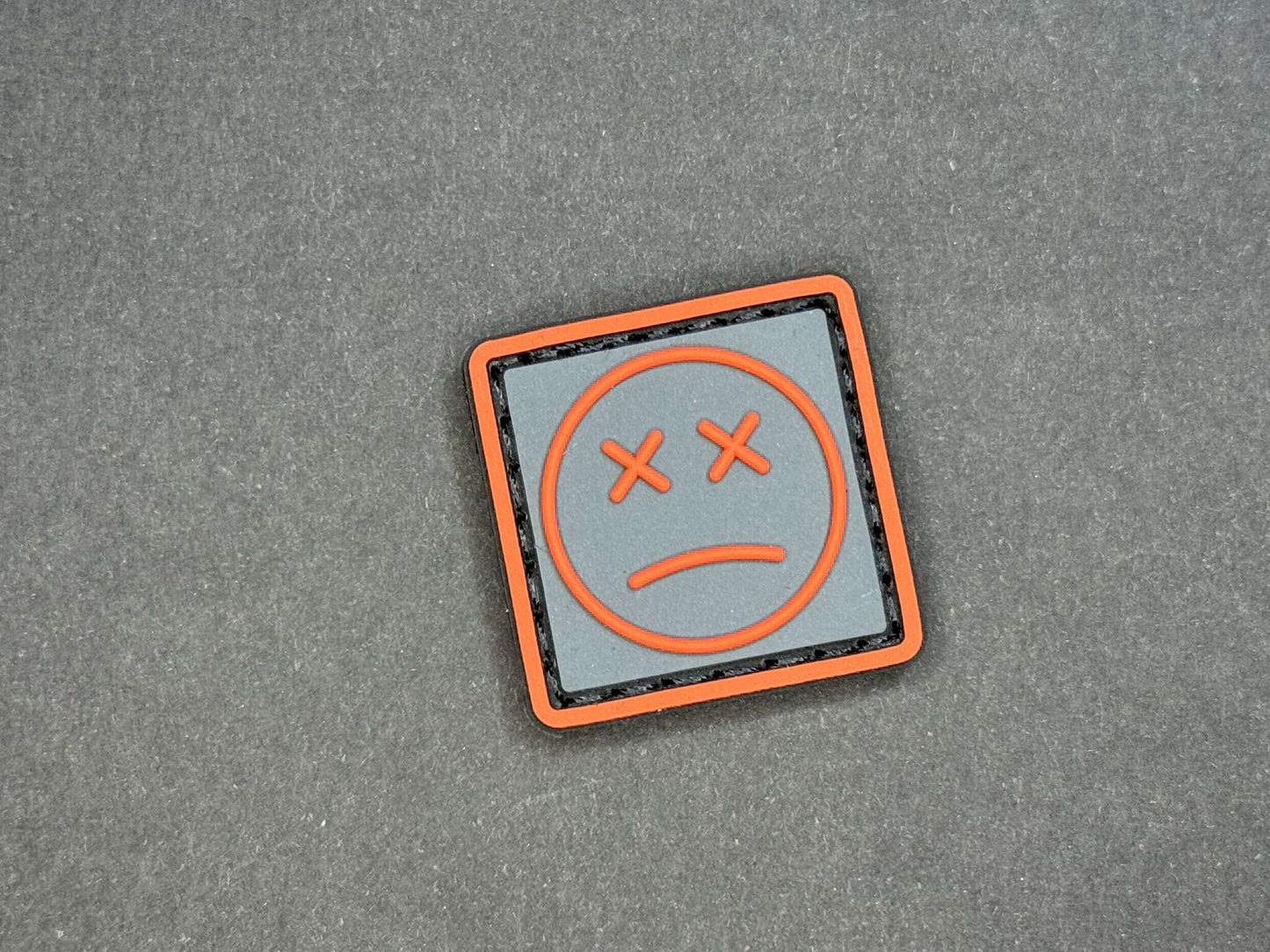 PVC Velcro Patch Sad Face Dark Grey and Orange