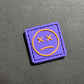 PVC Velcro Patch Sad Face Purple and Yellow